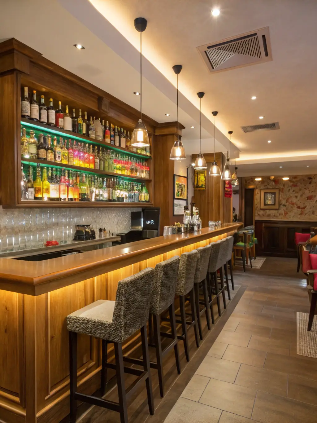 A vibrant photo of the PalaFeltre bar area, featuring a selection of beverages and snacks, with people enjoying refreshments.