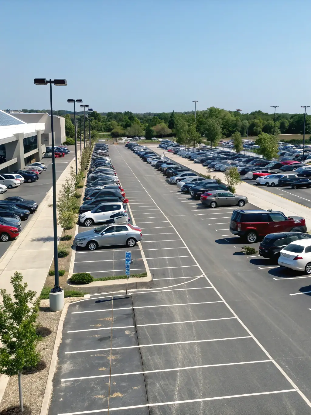 A well-lit and accessible parking area at PalaFeltre, showing ample parking spaces and easy access to the stadium entrance.
